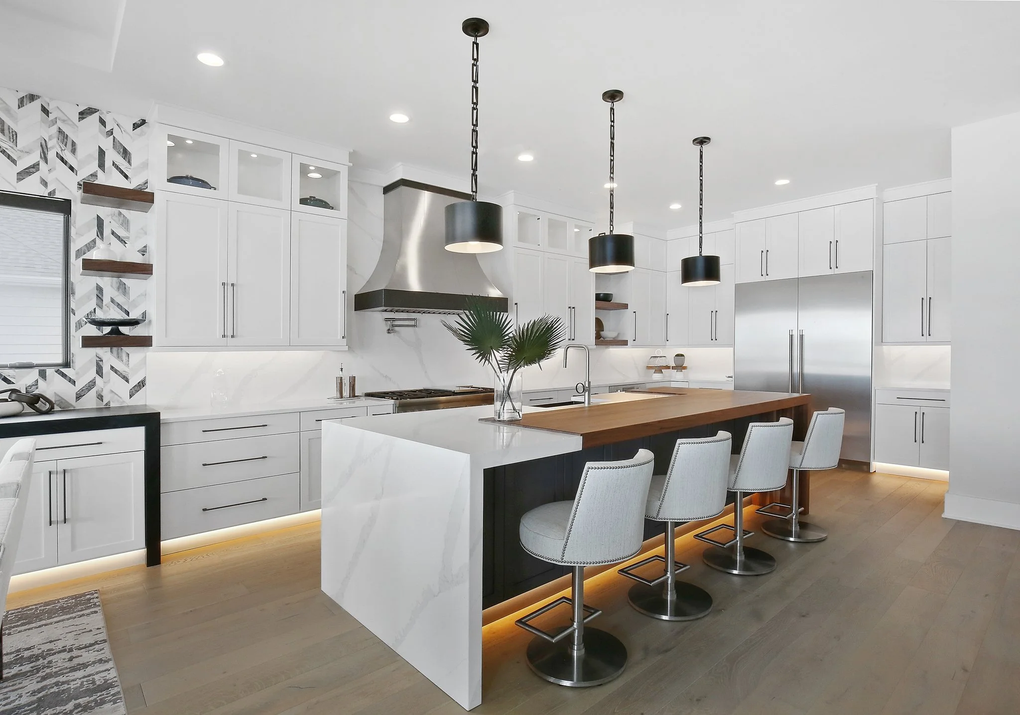 Boutique interior with layered lighting, upholstered seating and considered material detail